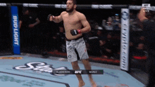 a man in a boxing ring with the name muniz on the corner