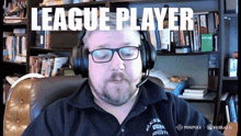 a man wearing headphones and a shirt that says ' league player ' on it