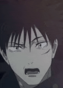 a close up of a person 's face with a shocked look on their face .