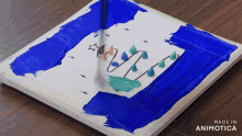 a painting of a christmas tree is being made in animatica