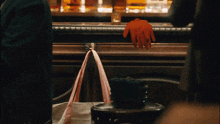 a woman 's hand is reaching out towards a bar