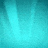 a turquoise background with a blurred texture and a light coming through it .