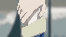 a close up of a person holding a piece of paper in their hand
