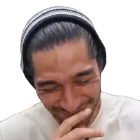 a man with a beard wearing a beanie is smiling with his eyes closed