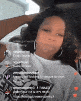 a woman is sitting in a car with her hand in her hair and a few people are talking to her