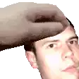a hand is touching a man 's forehead with a white background .
