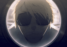 a close up of a person wearing sunglasses looking through a window