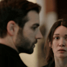 a man and a woman looking at each other