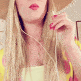 a woman wearing a sombrero and headphones smiles