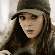 Elizabeth Olsen Stare GIF - Elizabeth Olsen Stare Look Down GIFs