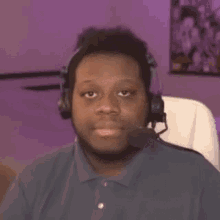 a man wearing headphones is making a face and says yep