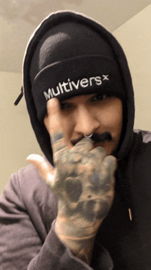 a man wearing a black hat that says multiversx