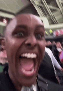 a close up of a person making a funny face with their mouth open