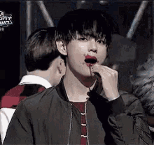 taehyung putting lipstick on his
