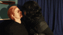 a couple kissing with one wearing a helmet that says kylo ren