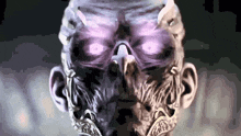 a close up of a skull with purple eyes and a beard