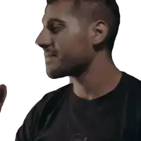 a man wearing a black shirt that says ' com ' on the front