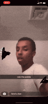 a screenshot of a young man 's face with the caption rate the joside