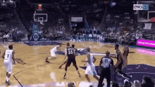 a basketball game is being played in a stadium with a fox sports logo on the screen