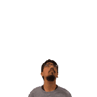 a man with glasses and a beard looks up at a green cross above his head