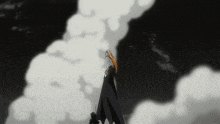 a black and white image of a person standing on a cliff