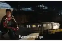 a man in a spiderman suit is kneeling down and says everywhere i go
