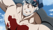 a man with a helmet on has a bloody wound on his chest