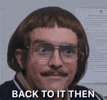 a man with glasses and a moustache has the words back to it then written on his face