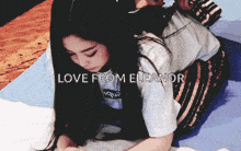 a woman is laying on a bed with the words love from eleanor written above her
