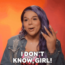 a woman with purple hair is saying i don 't know girl
