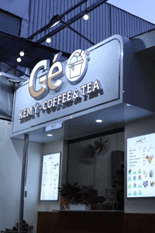 a store front with a sign that says ge kemy coffee and tea