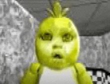 a close up of a yellow teddy bear with a surprised look on his face .