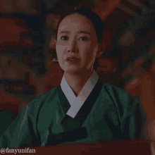 a woman in a green kimono with the hashtag @fanyunifan on the bottom