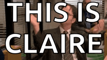 a man in a suit and tie says " this is claire " in front of a group of people