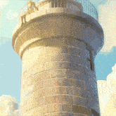 a girl sits on the top of a tall brick tower