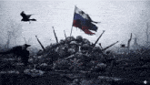 a pile of skeletons with a russian flag on top