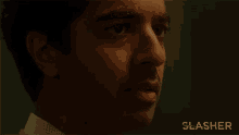 a close up of a man with the word slasher behind him