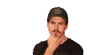 a man wearing a hat with the letter t on it is clapping his hands