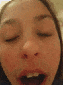 a woman making a surprised face with her mouth open
