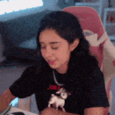 a woman wearing a black t-shirt that says jon on it