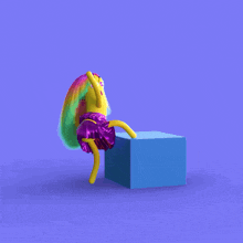 a cartoon character is sitting on a blue cube with her legs crossed
