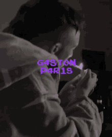 a man lighting a cigarette with a purple and green graphic that says gastown freakers