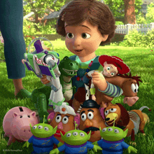a little girl is surrounded by toy story characters including buzz lightyear and mr potato head