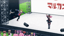 a group of people standing on a stage in front of a sign that says ' マルカ '