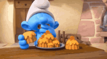 The Smurfs Muffins GIF - The Smurfs Muffins Eating GIFs