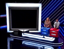 a man and a woman are playing a game on a stage with boxes that say brian and 320