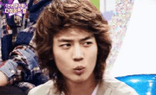 a close up of a man making a funny face with his mouth open