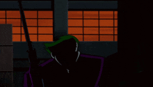 a cartoon of the joker holding a gun in his hand