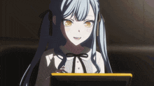 a girl with blue hair and yellow eyes is smiling while looking at a tablet