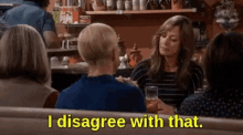 a group of women are sitting at a table in a diner and one of them is saying `` i disagree with that '' .